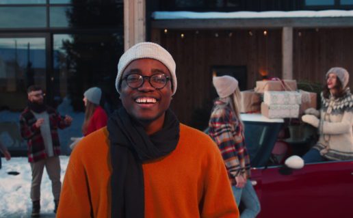 Man smiling outdoors in winter