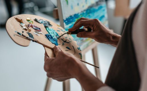 Artist Holding Palate and Paintbrush